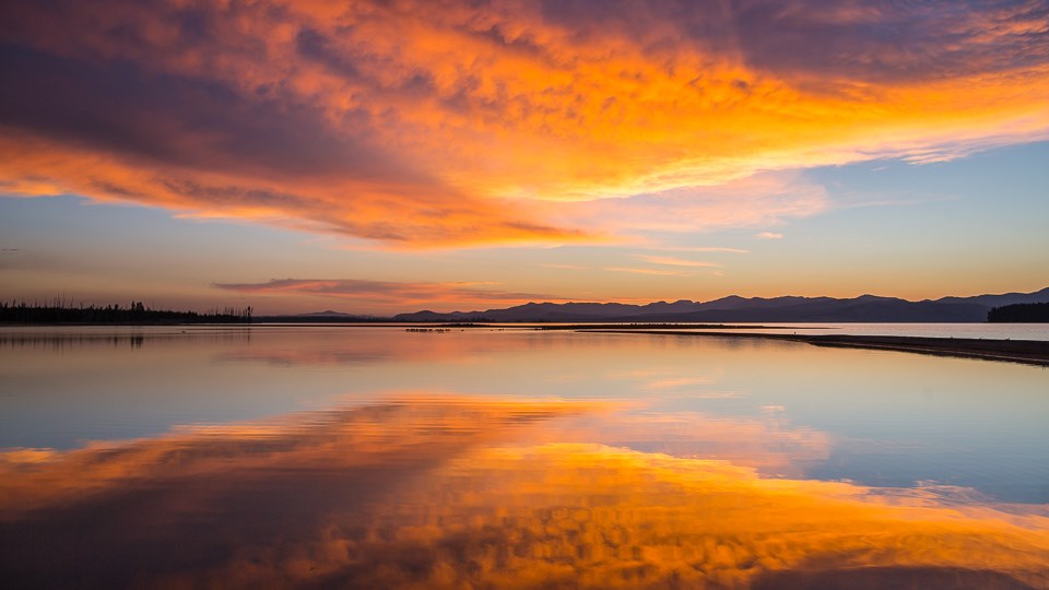 A sunset reflected in a big lake