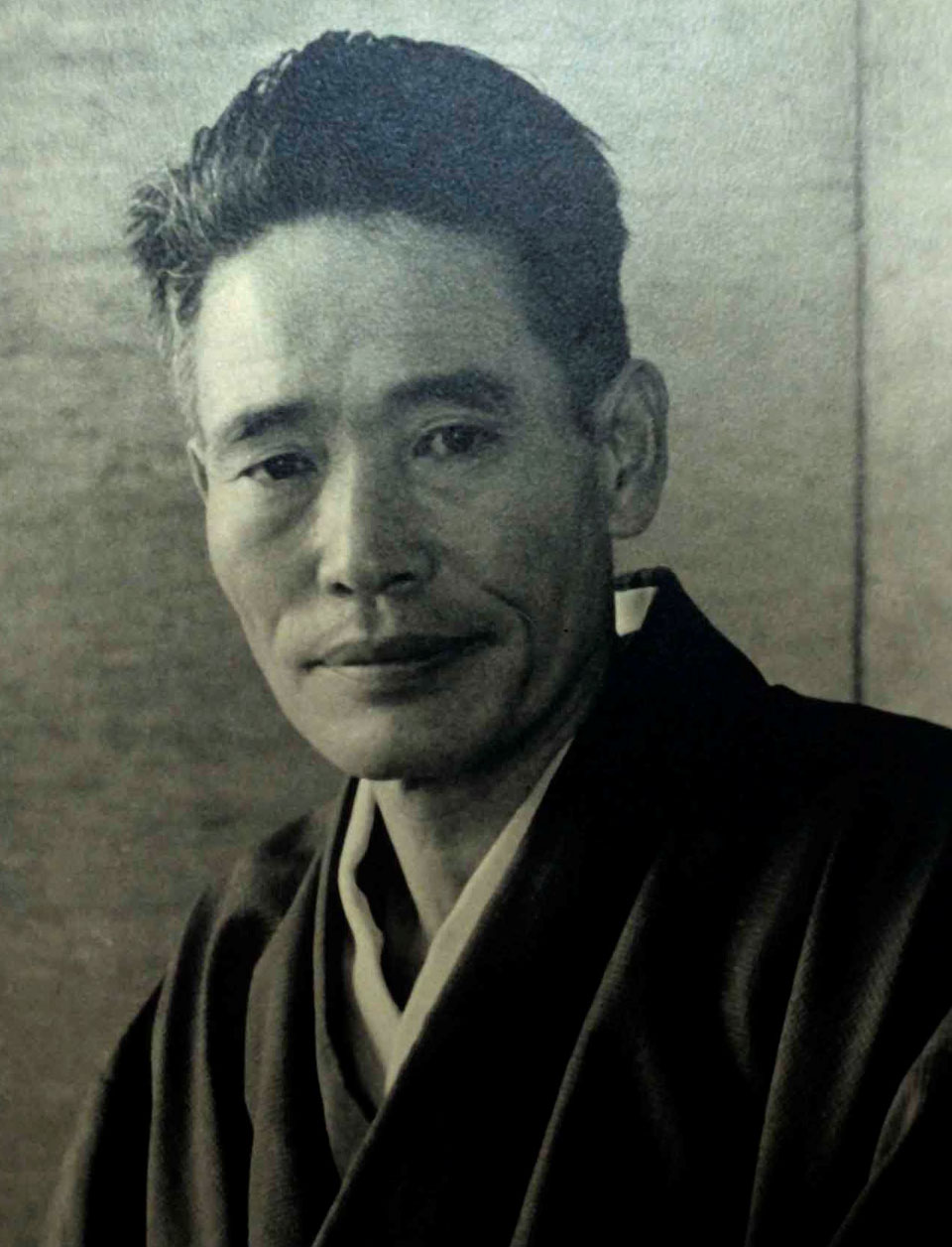 A black and white photographic portrait of Chiura Obata.