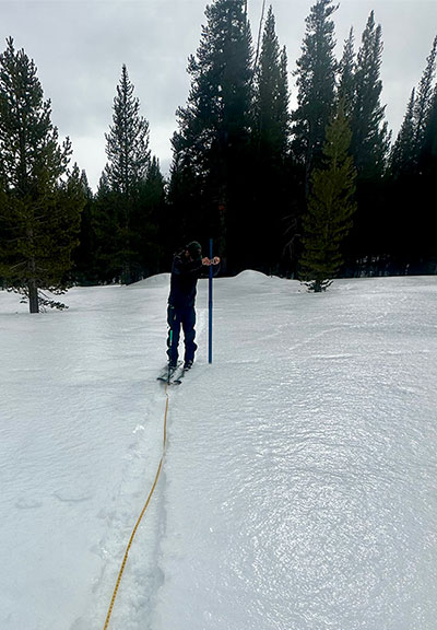 Snow survey with shiny rain crusted surface at Tuolumne Meadows on February 2, 2025.