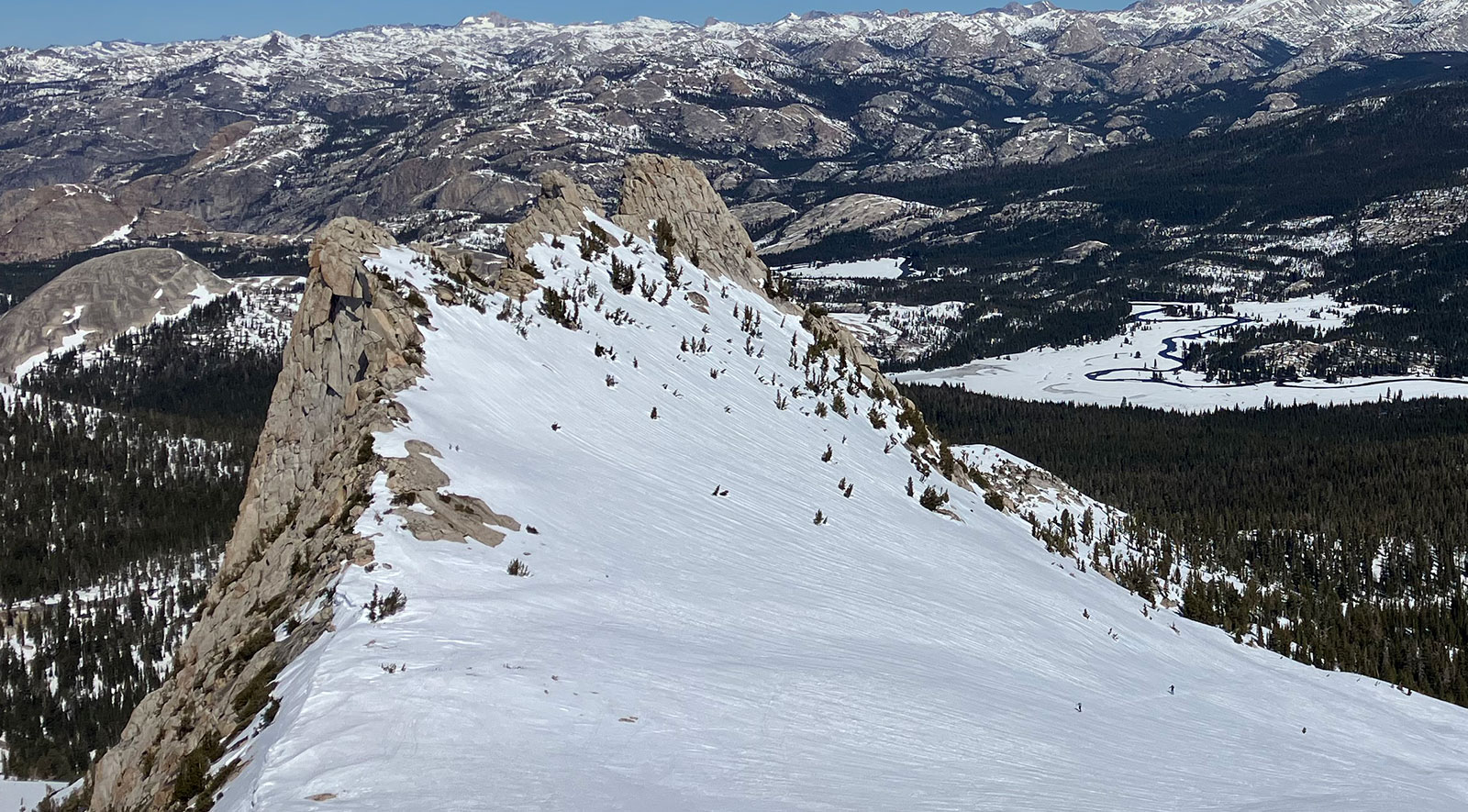 Skiers ascending Unicorn Bowl on March 19, 2026.