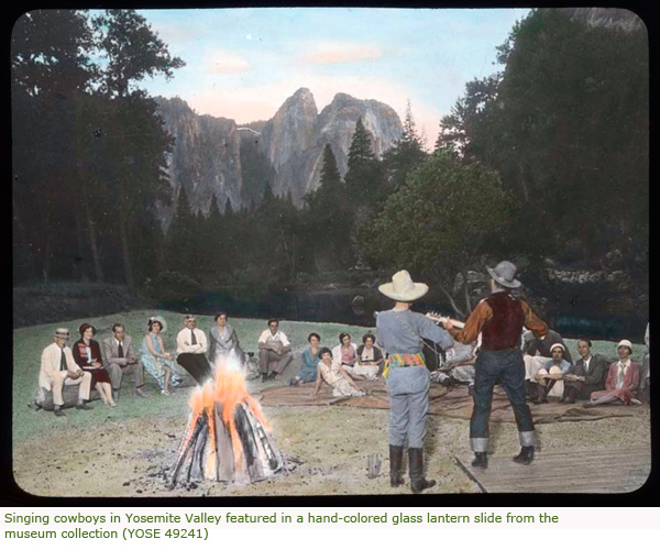 Singing cowboys in Yosemite Valley featured in a hand-colored glass lantern slide from the museum collection (YOSE 49241)