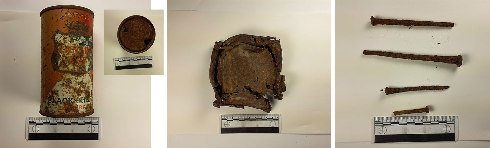 Old Canada Dry can with church key opening, rusty broken can fragment, and rusty square nails.