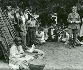 Cultural demonstrator and ranger with a group of visitors