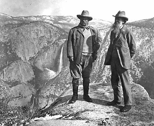 John Muir stands on Overhanging Rock with President Theodore Roosevelt