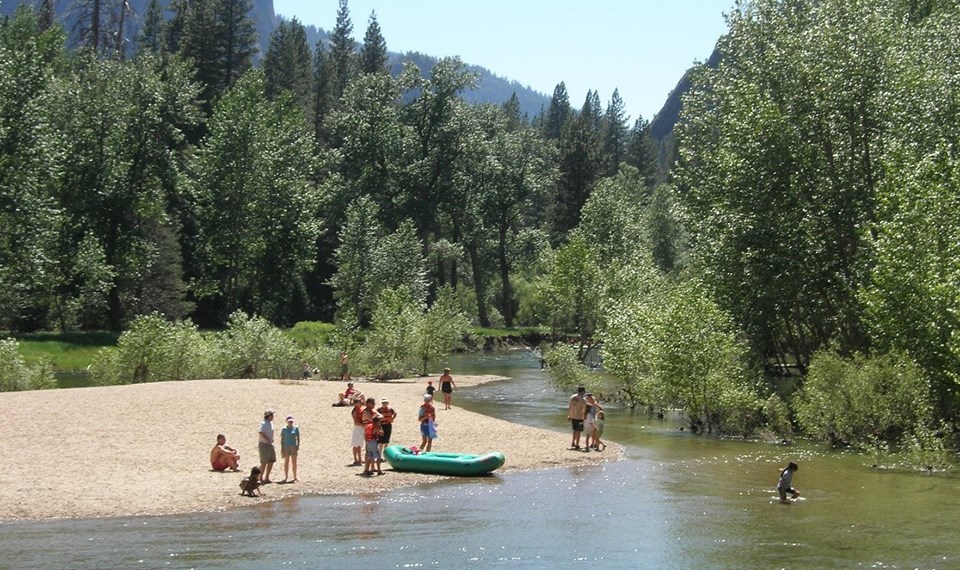 Visitors enjoying the Merced River in July 2008