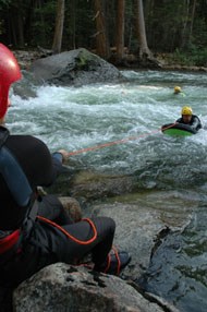 Yosemite Search and Rescue staff trains for swiftwater rescue in the cold Merced River