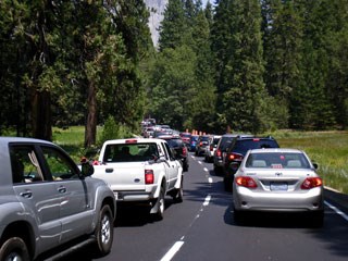 Two lanes of traffic with cars and a standstill from foreground to background