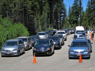 Three lines of cars waiting at a checkpoint