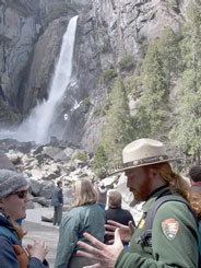 Park ranger talking to visitor at Lower Yosemite Fall