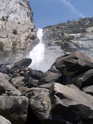 Wapama Falls heads toward boulders at its base
