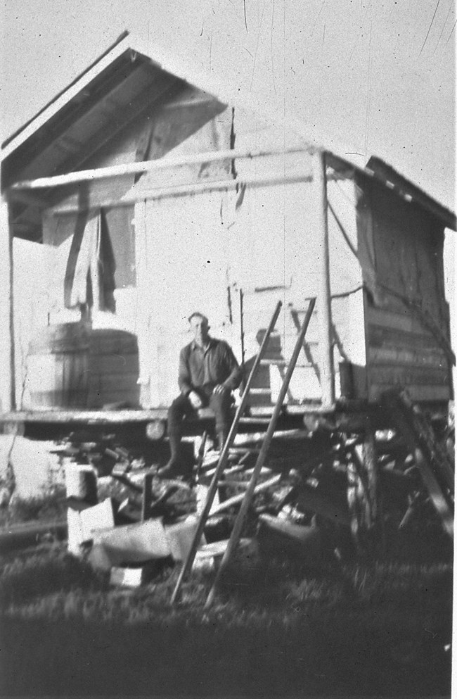 The frame-built cache and drying shed at Slaven’s Roadhouse on the banks of the Yukon River, ca. 1935. This cache still exists, but today it sits on the ground.