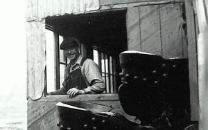 Historic photo of Al Hendricks manning the Coal Creek dredge wheelhouse circa 1936.