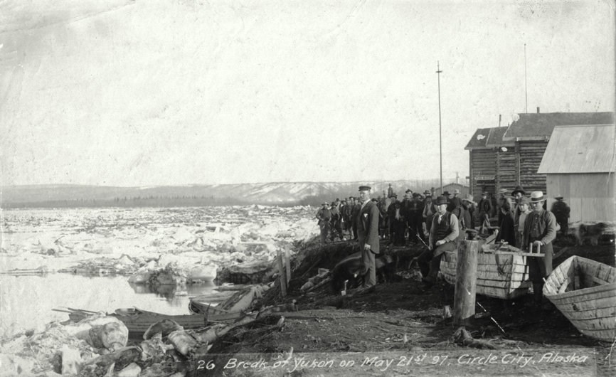 Circle City residents watch ice breaking up on the Yukon River, May 21, 1897.