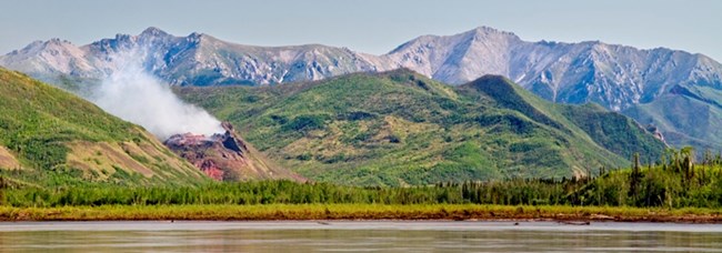 A panormic photo of the Windfall Mountain Fire from the Yukon River