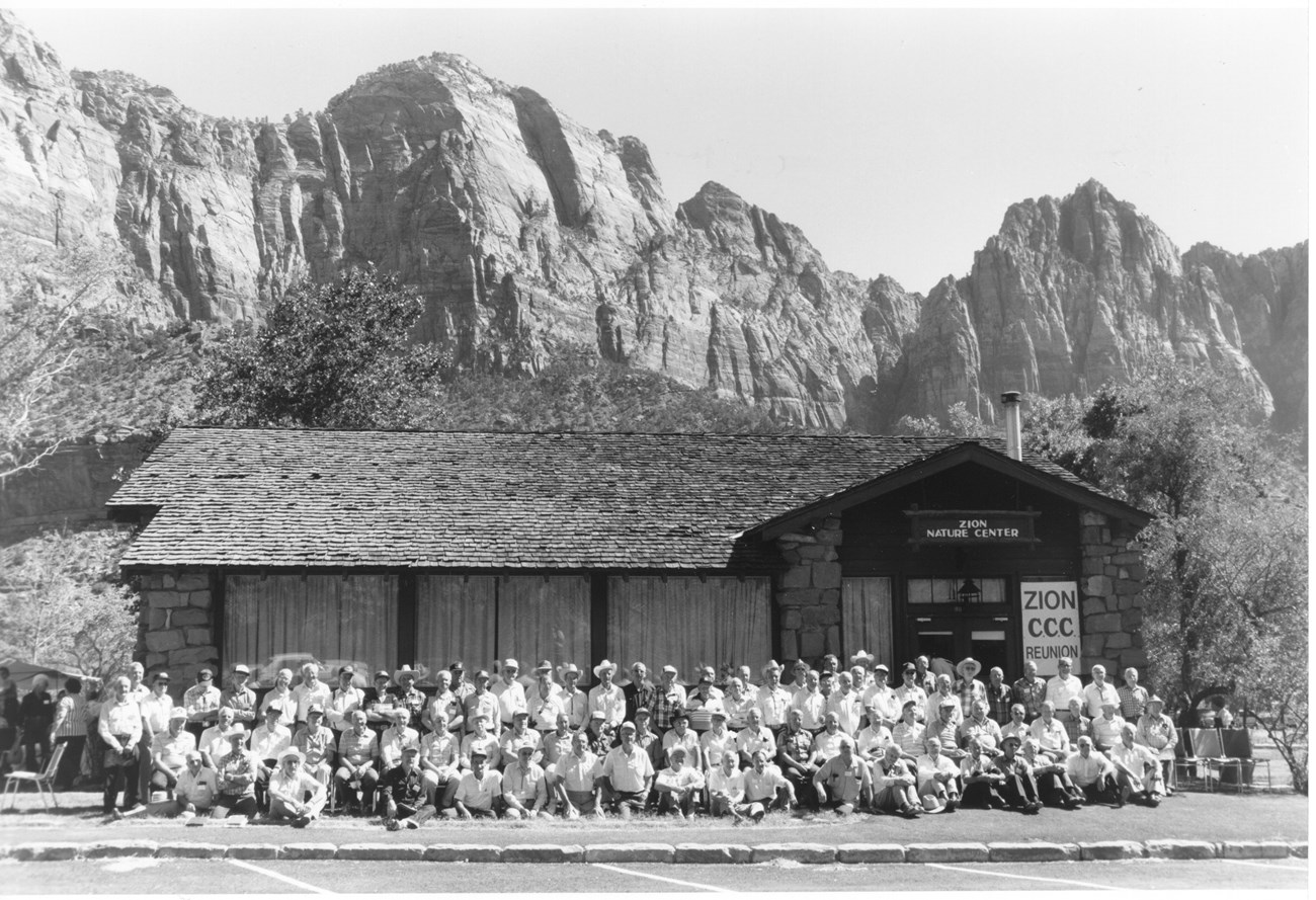 ZION 12320: This photo, taken in front of the Nature Center, documents the attendees that joined the reunion hosted by the park in September 1989.