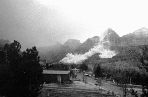 a black and white photo of dust from a rockfall in Zion